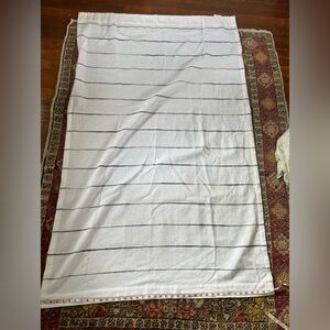 White cloth curtains w grey stitching